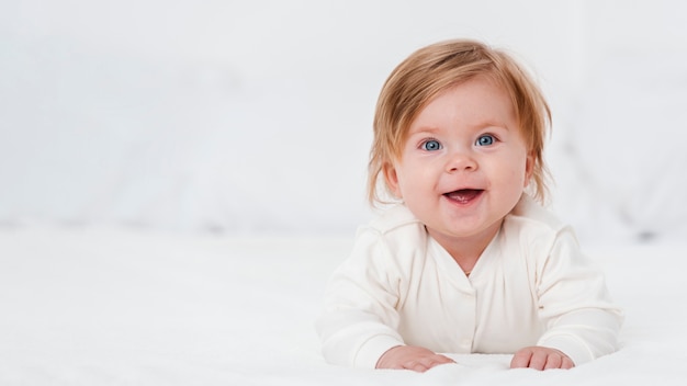 Happy baby posing with copy space