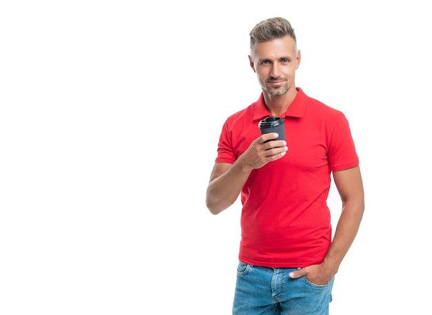 Happy barista in casual red tshirt holding disposable cup with takeaway tea isolated on white