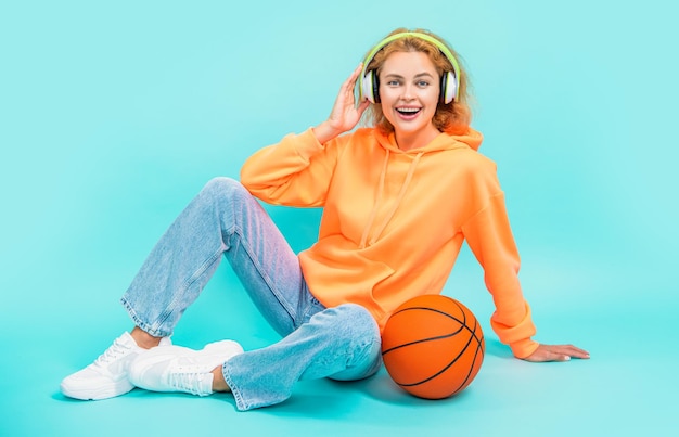 Happy basketball woman player isolated on blue background basketball woman player