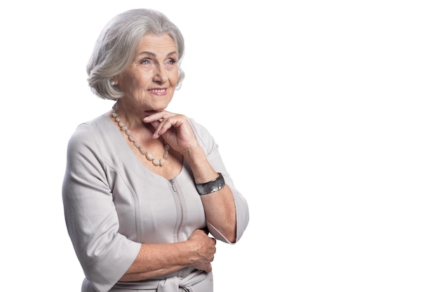 Happy beautiful senior woman posing on white background