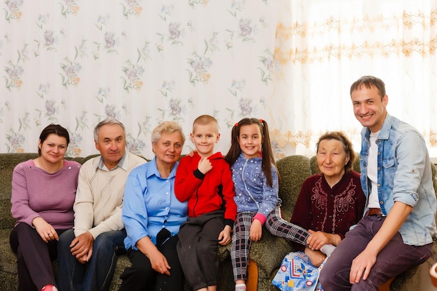 Photo happy big family on the sofa at home