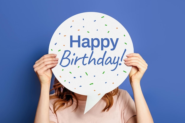 Happy birthday greeting poster decorated with confetti and text on blue background