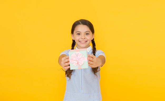 Happy birthday Knowledge day Schoolgirl giving gift to you Generosity concept Holiday celebration Girl received gift Tidy adorable pupil open gift box Educational program for gifted kids