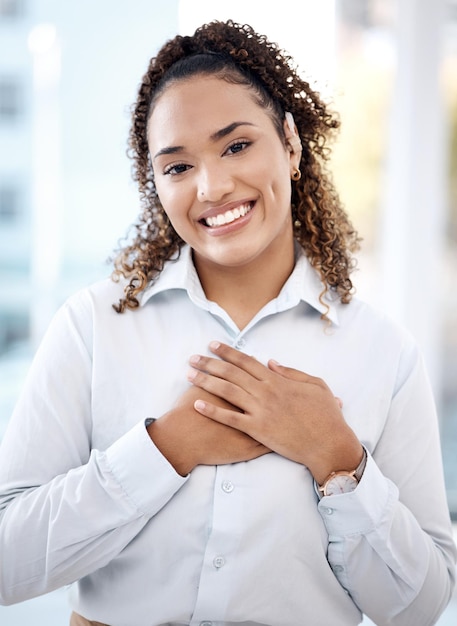 Happy black woman and business portrait with hands on chest for care kindness and love for charity Face of person with smile and emoji for heart thank you and gratitude or trust and hope mockup