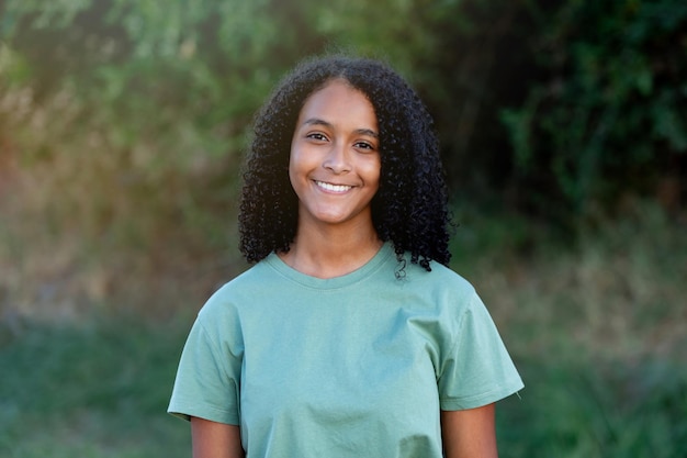 Happy black woman on holiday in the countryside for adventure peace and calm in summer