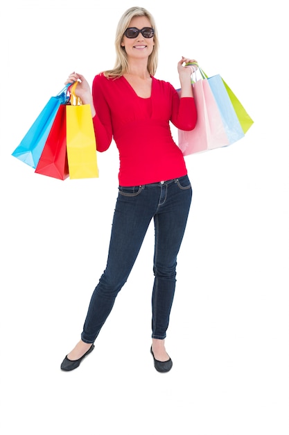 Happy blonde holding shopping bags