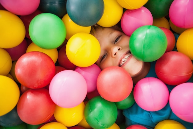 Happy boy playing in ball pool 