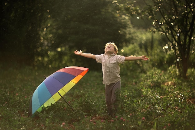 Happy boy rejoices at the end of the rain