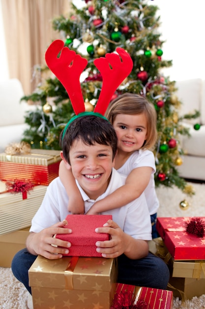 Happy brother and sister celebrating Christmas