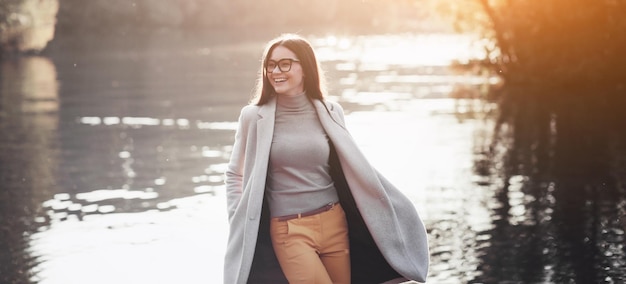 Happy brunette woman in autumn Park