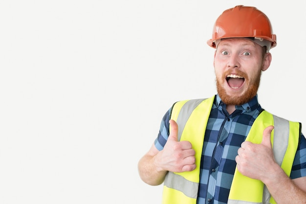 Happy builder in helmet on a white background