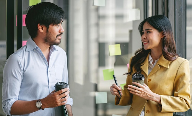 Happy business colleagues having discussion during working at office