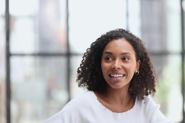 Happy business woman smiling inside office building