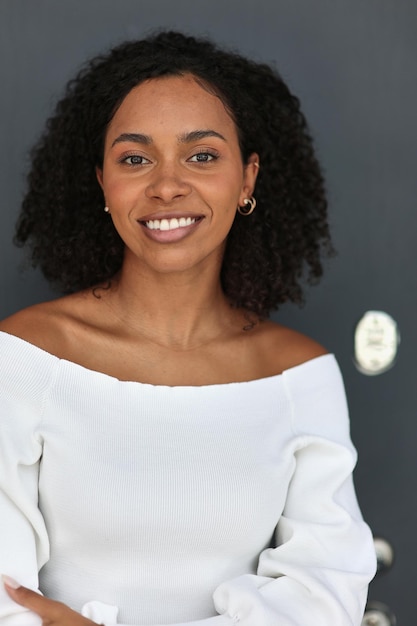 Happy business woman smiling inside office building