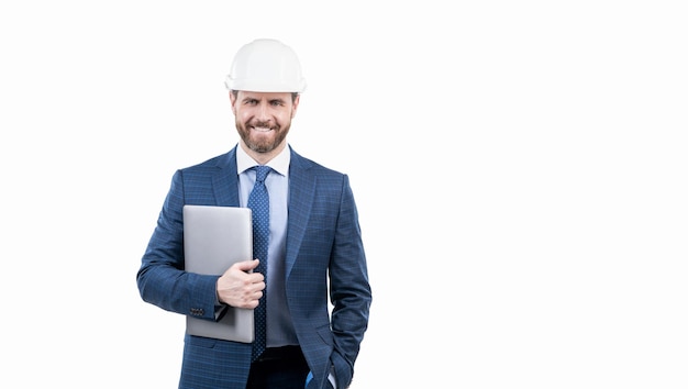 Happy businessman man in suit and safety helmet hold laptop isolated on white copy space safety business