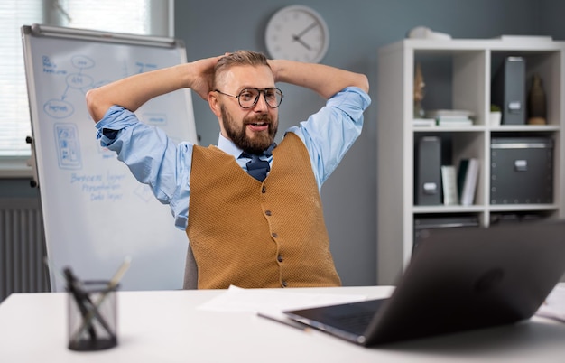 Happy businessman at office