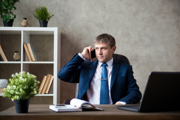 Happy Businessman Talking On Telephone Over White Background