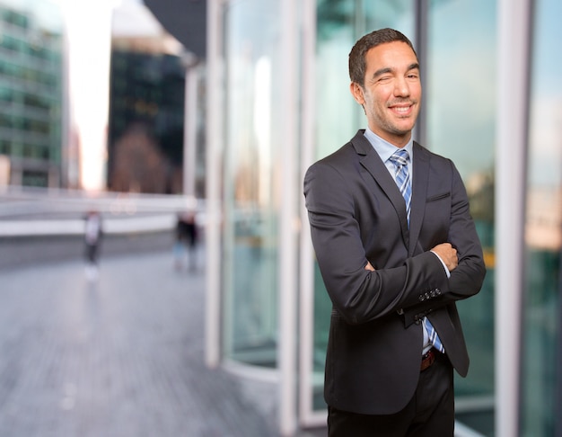 Happy businessman winking an eye