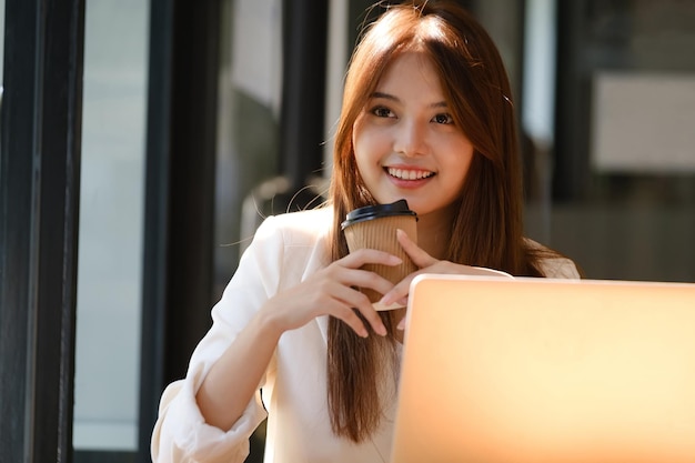 Happy businesswoman relaxing at office desk