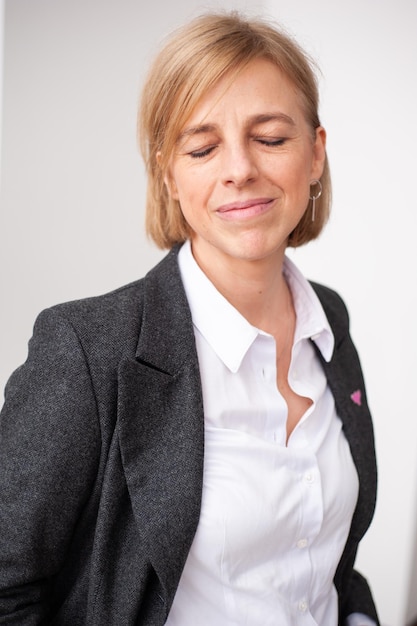 Happy businesswoman on white background