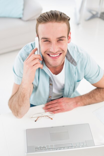 Happy casual businessman on the phone 