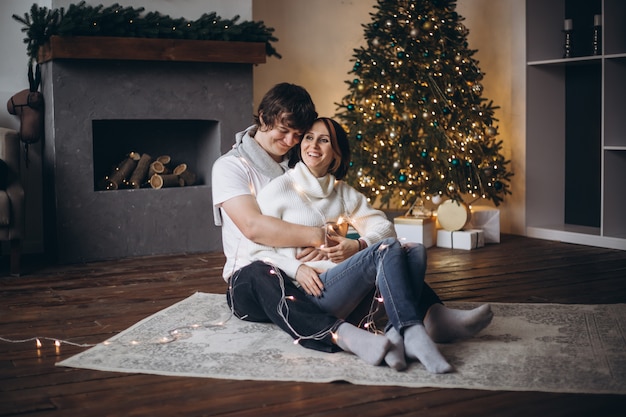 Happy caucasian couple laughing togetherness in cozy home space