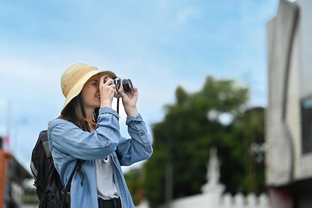 Happy caucasian female traveler with backpack on holiday vacation trip in Thailand Blogger vacation and journey concept