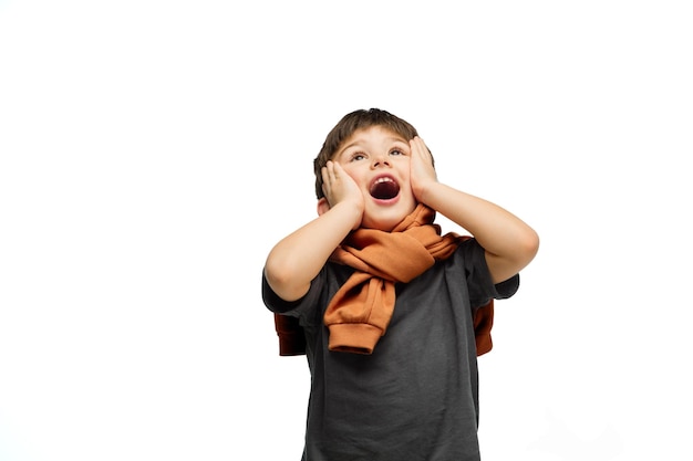 Happy caucasian little boy isolated on white studio background Looks happy cheerful sincere Copyspace Childhood education emotions concept