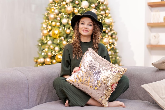 Happy caucasian young woman christmas in winter house Lady in black hat