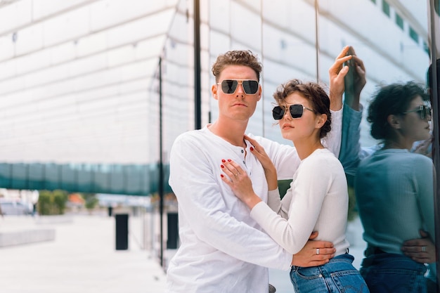 Happy cheerful couple in sunglasses