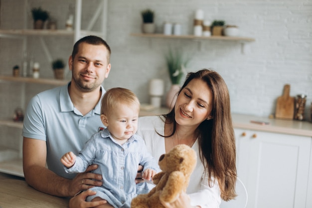 Happy cheerful young family at home