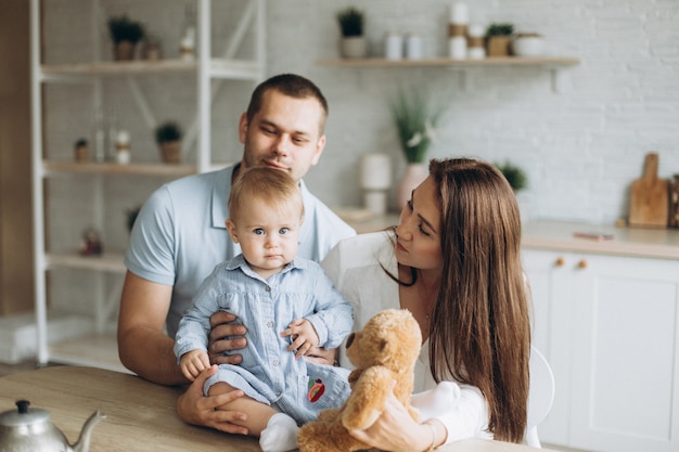 Happy cheerful young family at home