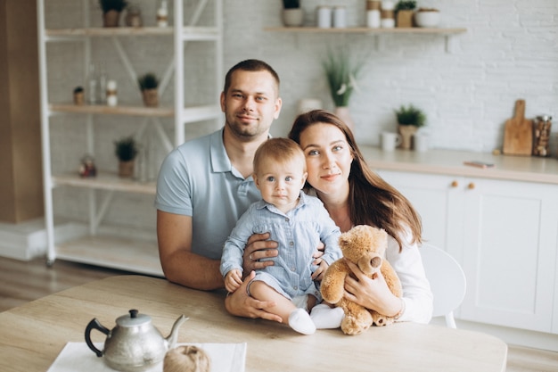 Happy cheerful young family at home