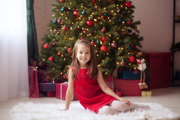 Happy child girl at home on New Year's Eve