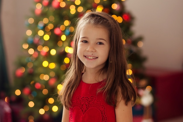 Happy child girl at home on New Year's Eve