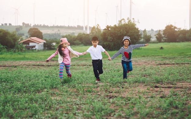 Happy child playing with colorful toy balloons outdoors