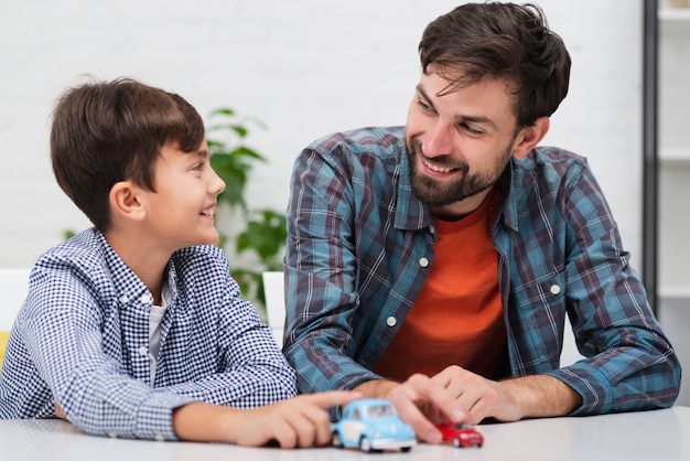 Happy child playing with his father