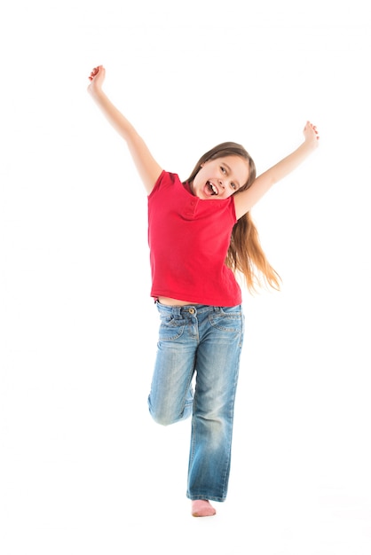 Happy child posing standing on one leg