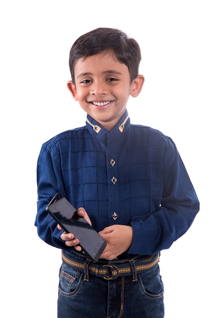 Happy child using cell phone on white background.