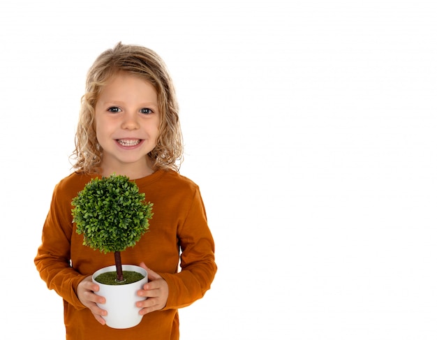 Photo happy child with a small tree