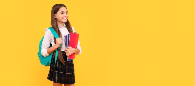 Happy childhood positive kid going to do homework teenager student hold planner Banner of school girl student Schoolgirl pupil portrait with copy space