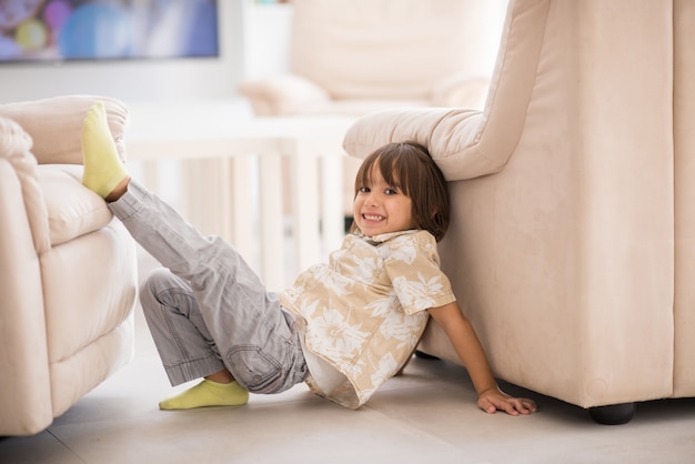 Happy children having fun and posing in new modern home