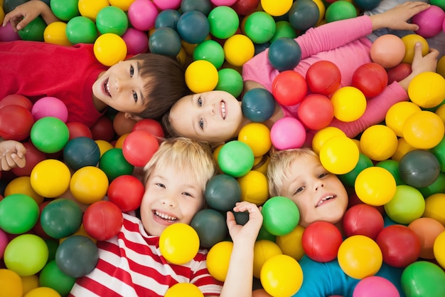 Happy children playing in ball pool