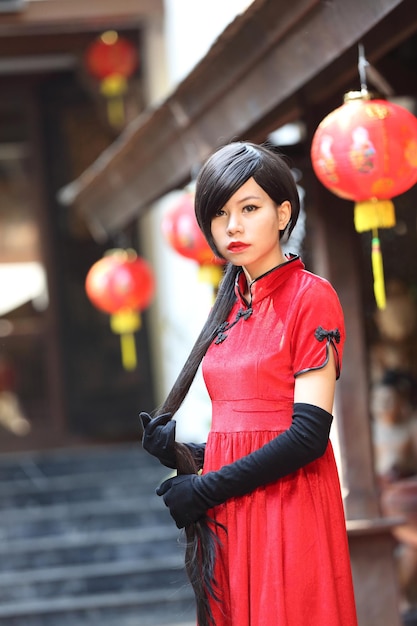 Happy Chinese new year. beautiful young Asian woman dress traditional cheongsam