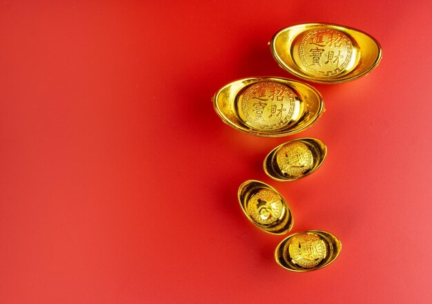 Happy Chinese New Year Chinese Gold Sycee Isolated red Copy space Usable for wallpaper greeting card design