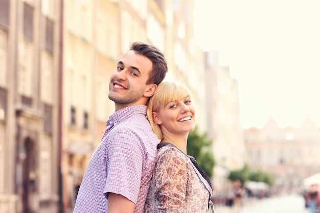 happy couple admiring architecture in the Old Town of Gdansk in Poland