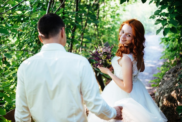 Happy couple bride on a summer day outdoors