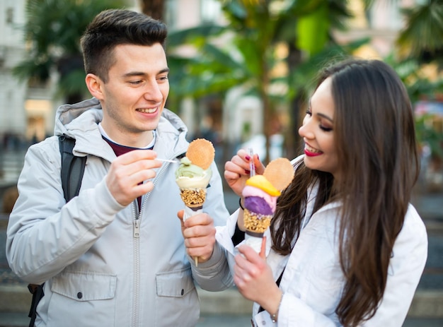 Happy couple eating an ice cream