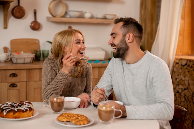 Happy couple eating together