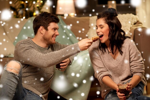 happy couple eating waffles with cacao at home